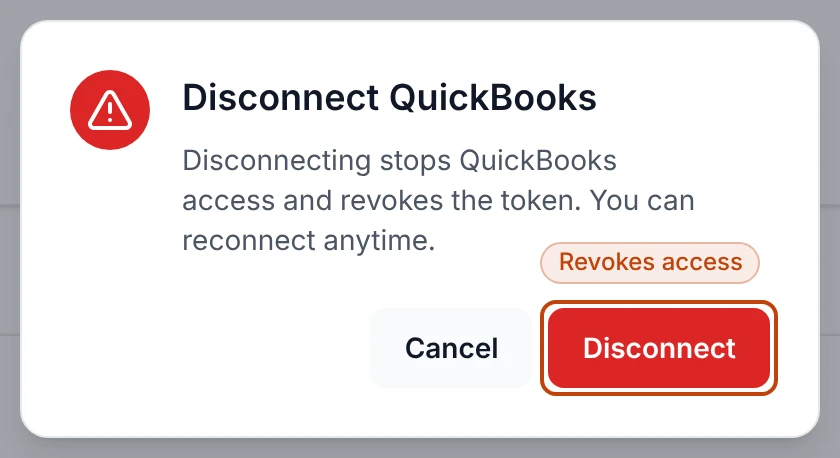 The confirm dialog before disconnecting QuickBooks, warning that it revokes access and that you can reconnect anytime.